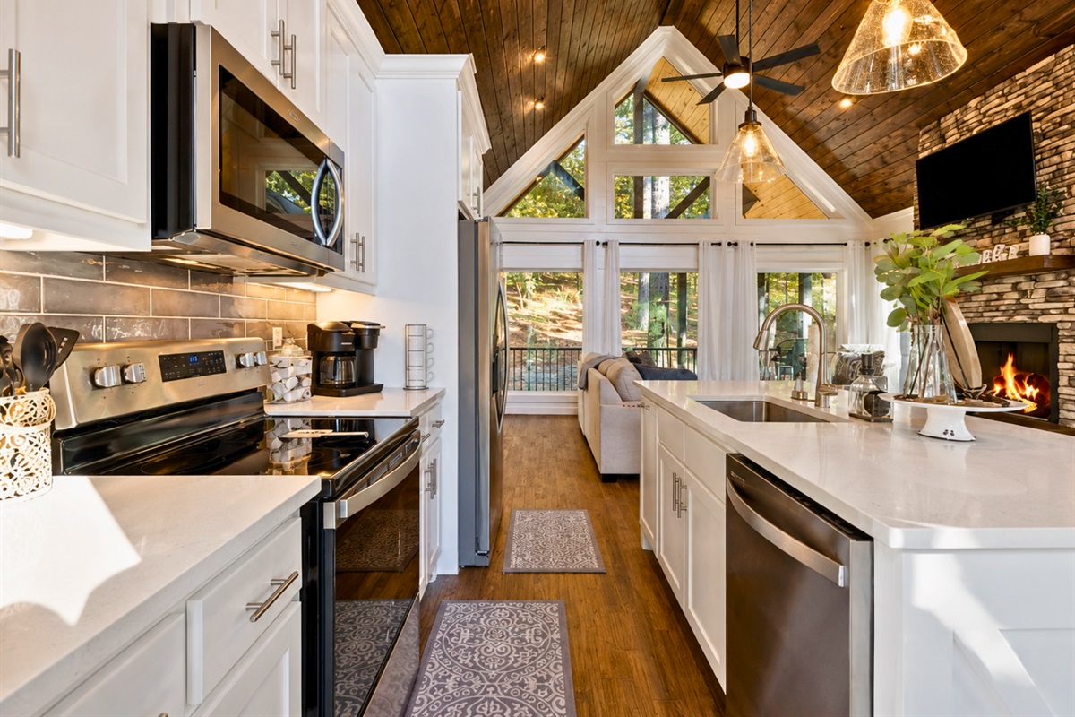 The fully equipped kitchen flows seamlessly into the living space, making it easy to enjoy every moment together without missing a beat.