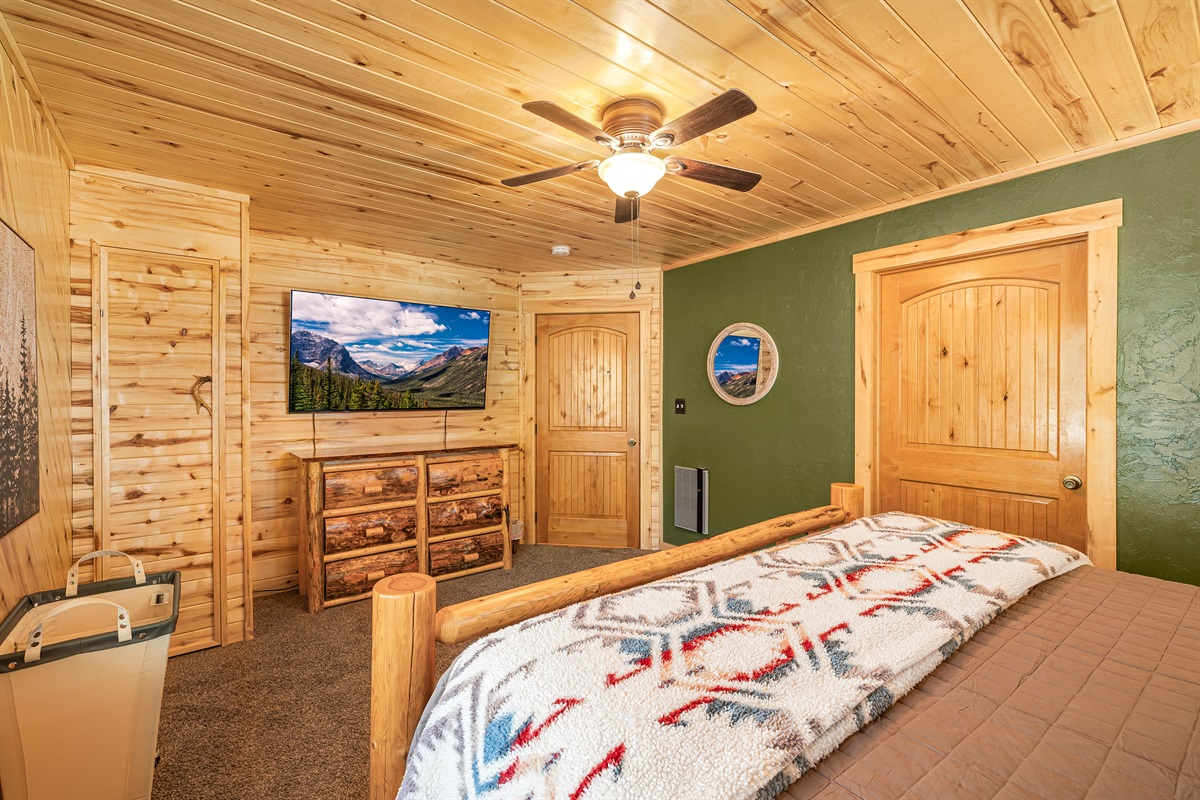 Master bedroom w/ king sized bed and private ensuite bathroom