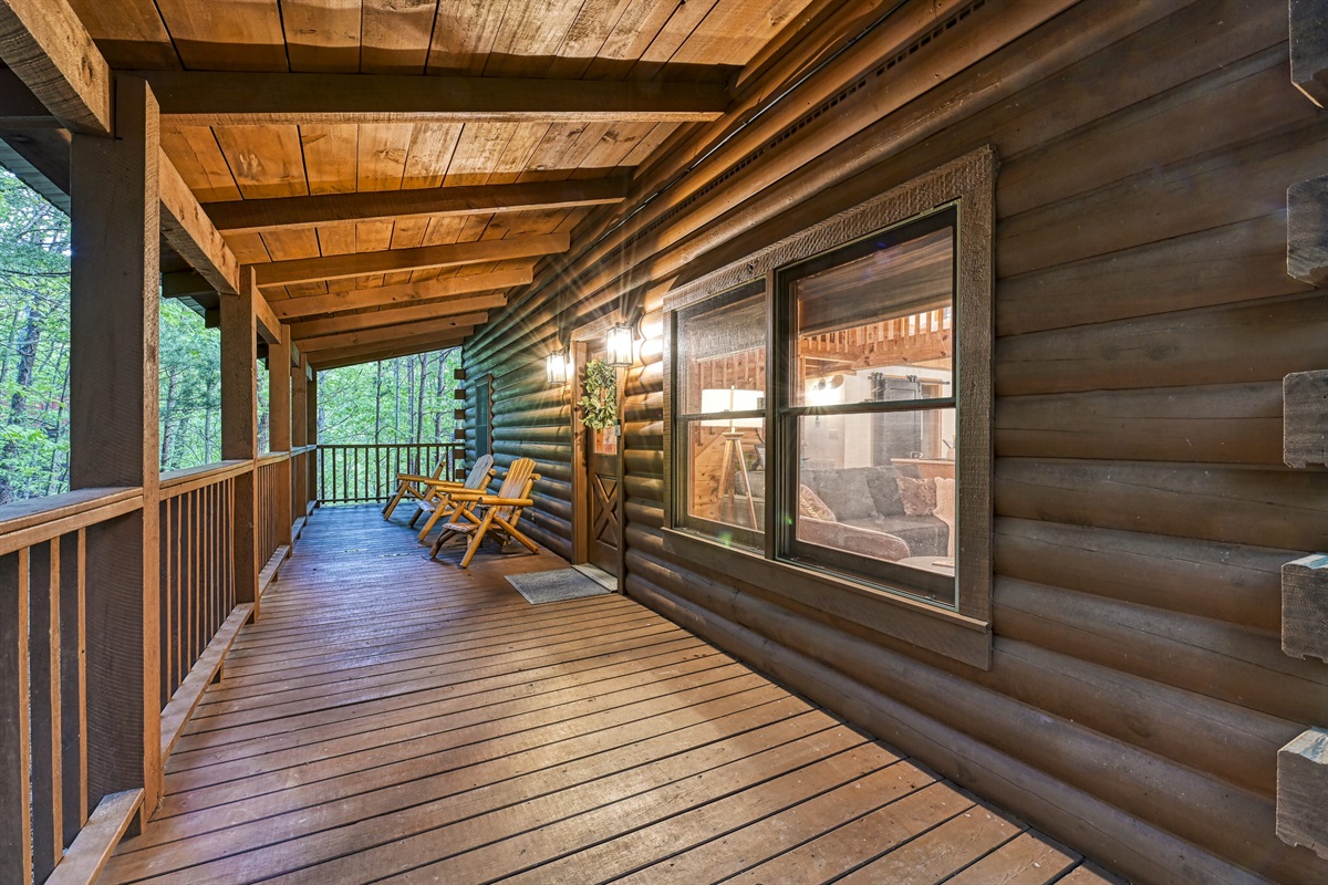 Welcoming front porch to enjoy the trees and wildlife surrounding the cabin