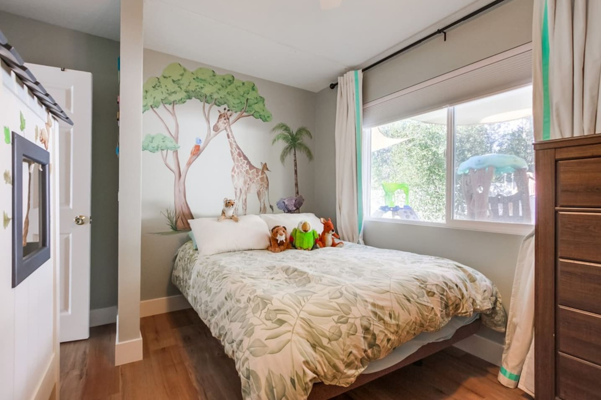 Safari Park Bedroom two queen beds and a play kitchen