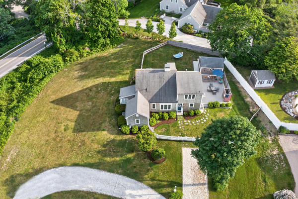 Aerial view showcasing the spacious property, large backyard, and private outdoor living areas.