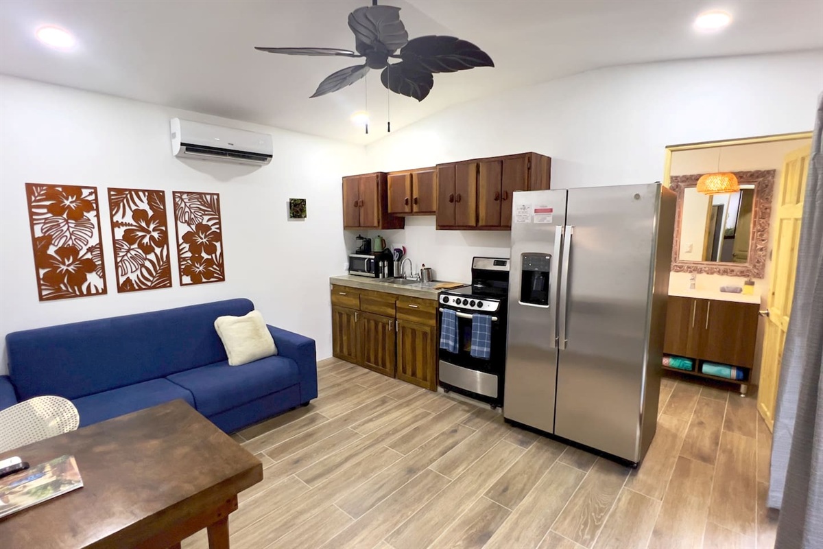Casa Cocos living room and kitchen area.  Bathroom entrance on the right.