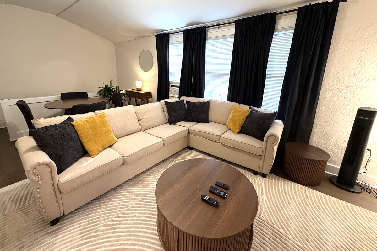 Living Area w/ 65" Smart TV and pull-out sofa bed