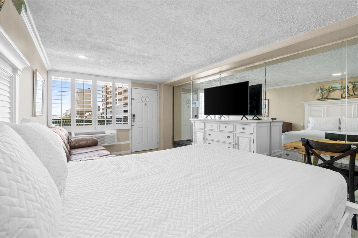 Living Area with Queen Bed and Sleeper Sofa