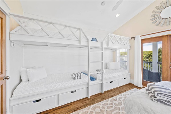 Four twin XL bunks on 3rd floor, along with queen bed and sitting area with wet bar and mini fridge.