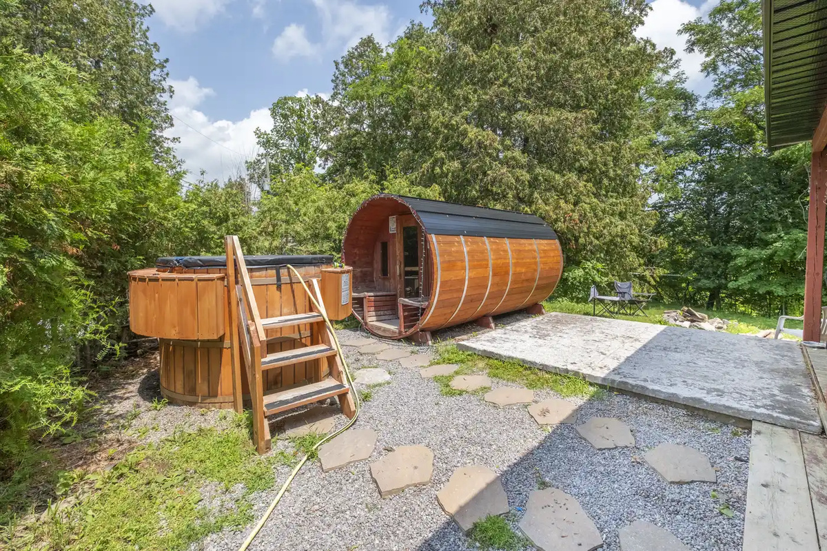 Private outdoor barrel sauna beside Cottage #4