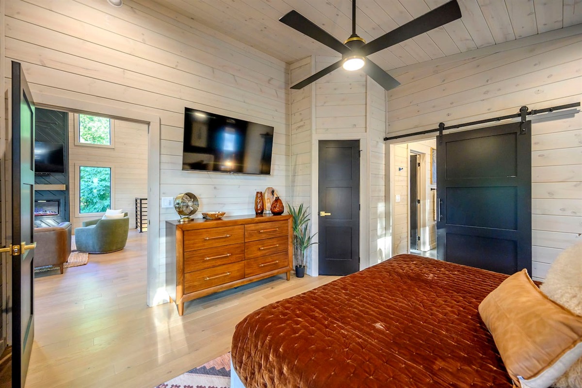 King bedroom has a 55" smart TV, clothes dresser and a closet for all your clothes storage needs.