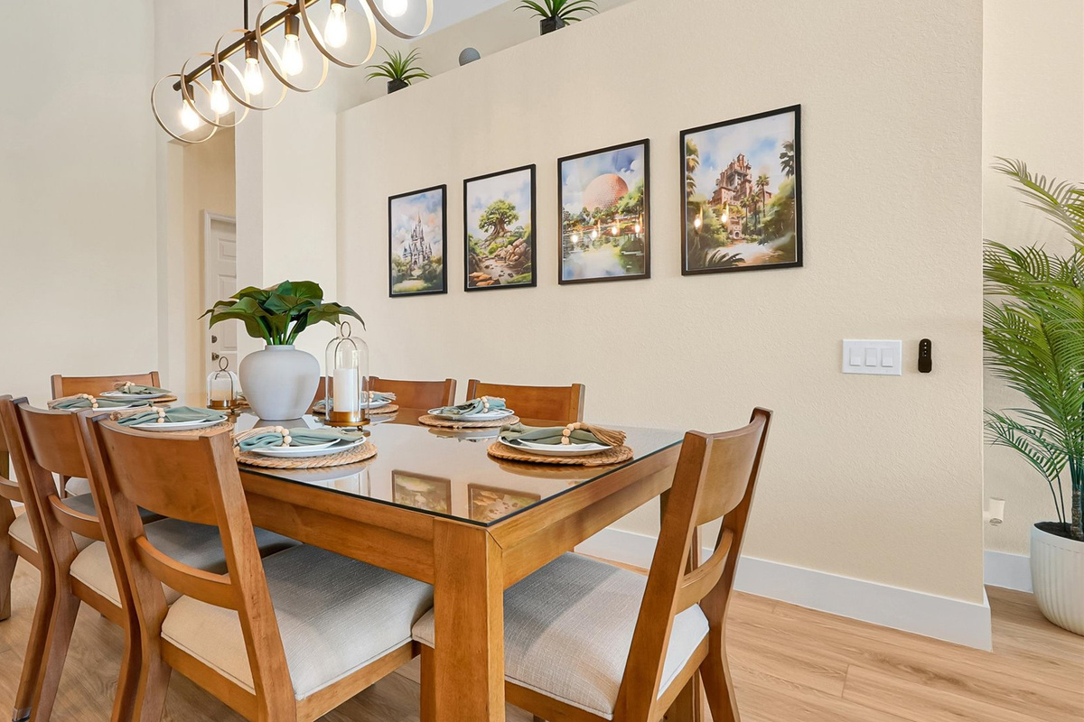 Dining Room: Spacious dining area with seating for 10 and artwork inspired by the four Walt Disney World theme parks.