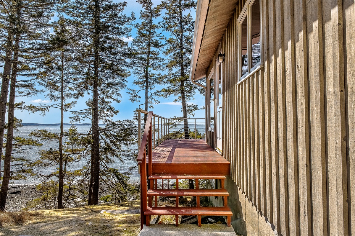 "A Breathtaking Arrival."
From the moment you step onto the main entry deck, the harbor opens up before you. This elevated walkway leads you into a home designed to keep the ocean in sight at all times.
