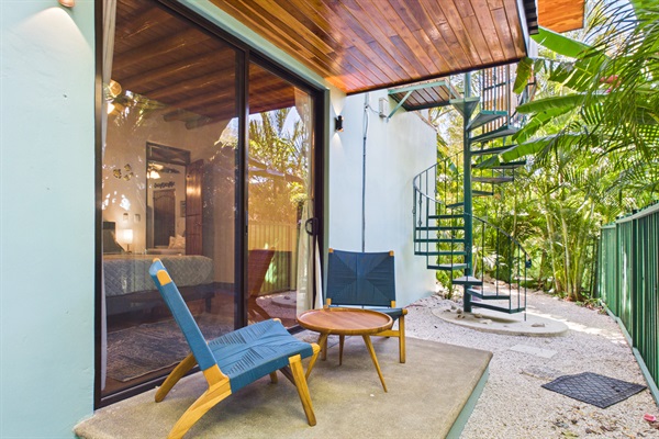 Private patio off bedroom 1 and covered outdoor spiral staircase to upstairs bedroom 5