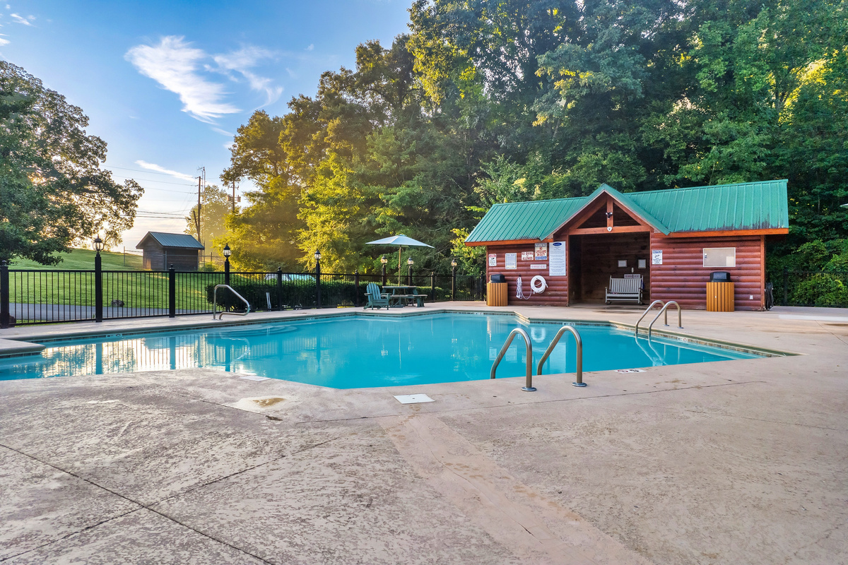 Take a refreshing dip in the spacious community pool, surrounded by lush greenery and mountain sunshine.