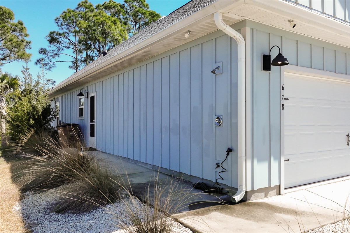 Outdoor shower available to rinse off sand before heading inside.