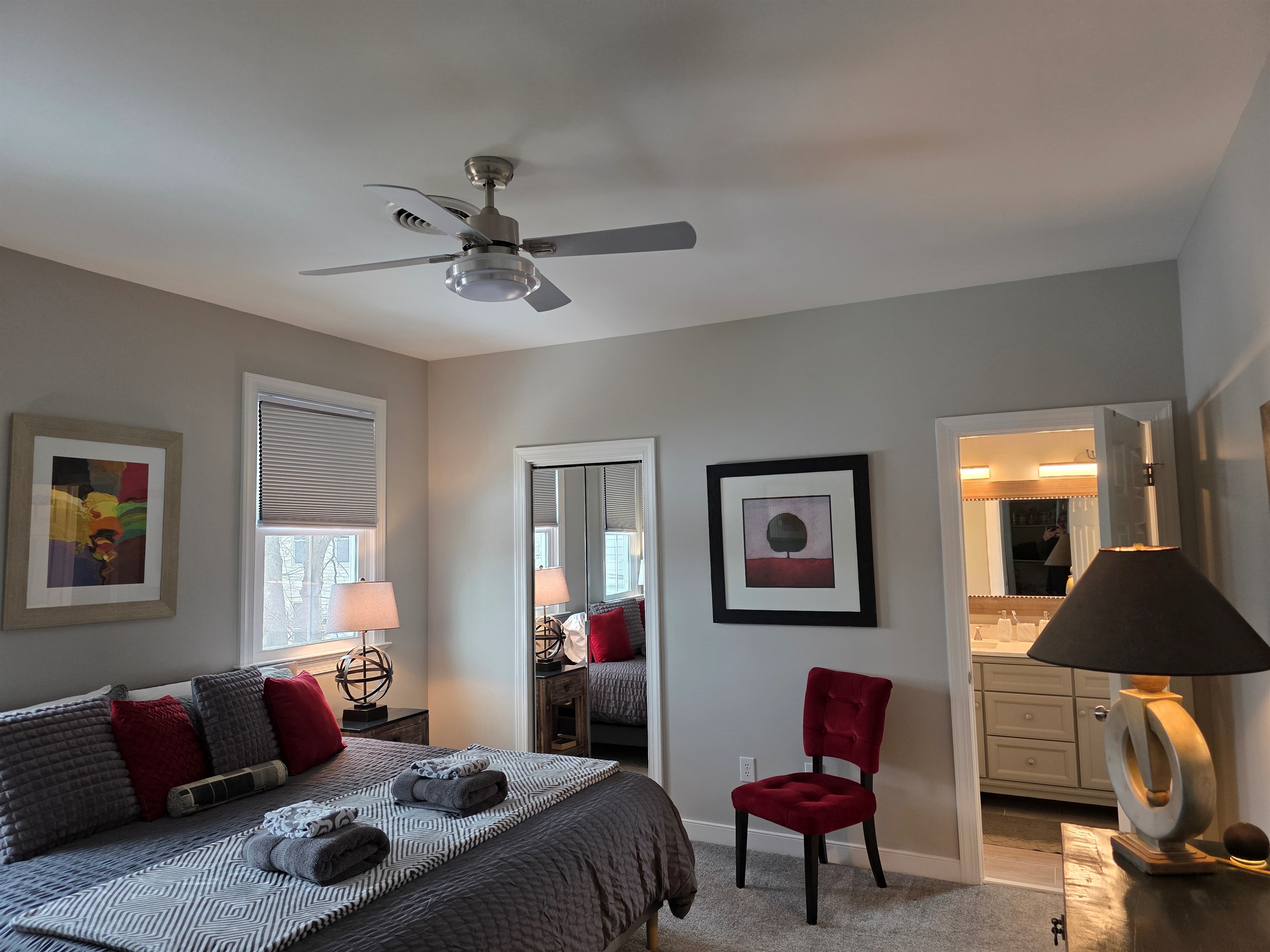 King Bedroom 1: Relax in style with bright light, plush bedding, and vibrant accents!