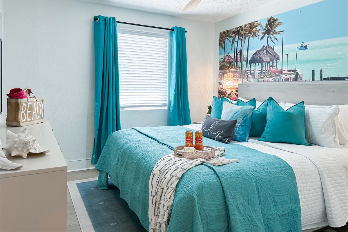 This bedroom has a comfy King bed, a closet, and a dresser.