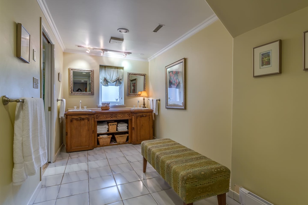 Master bathroom - antique sideboard serves as the bathroom counter.