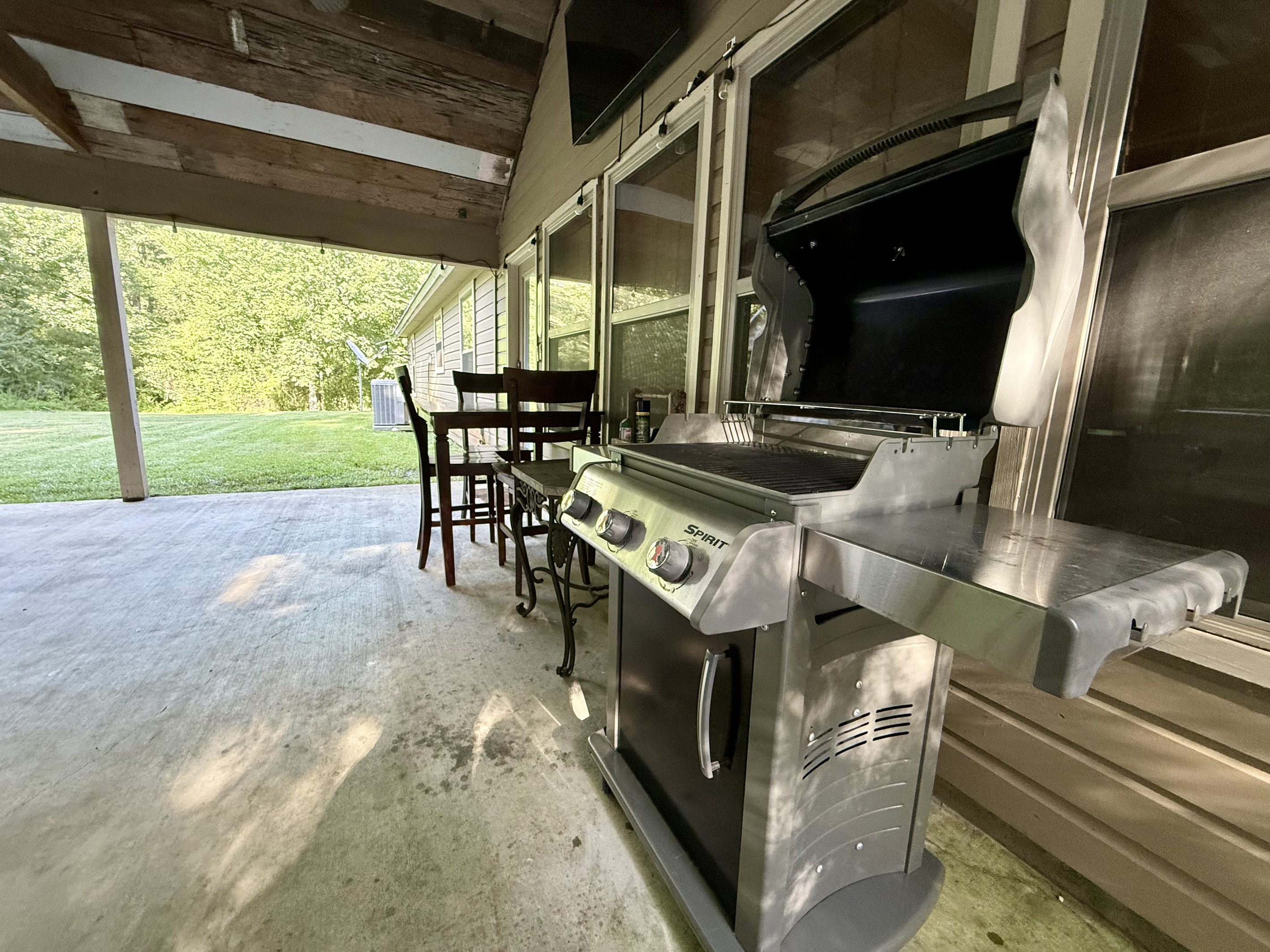 Grill burgers under the stars while watching Roku TV on the widescreen under the back patio.