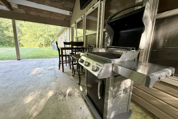 Grill burgers under the stars while watching Roku TV on the widescreen under the back patio.