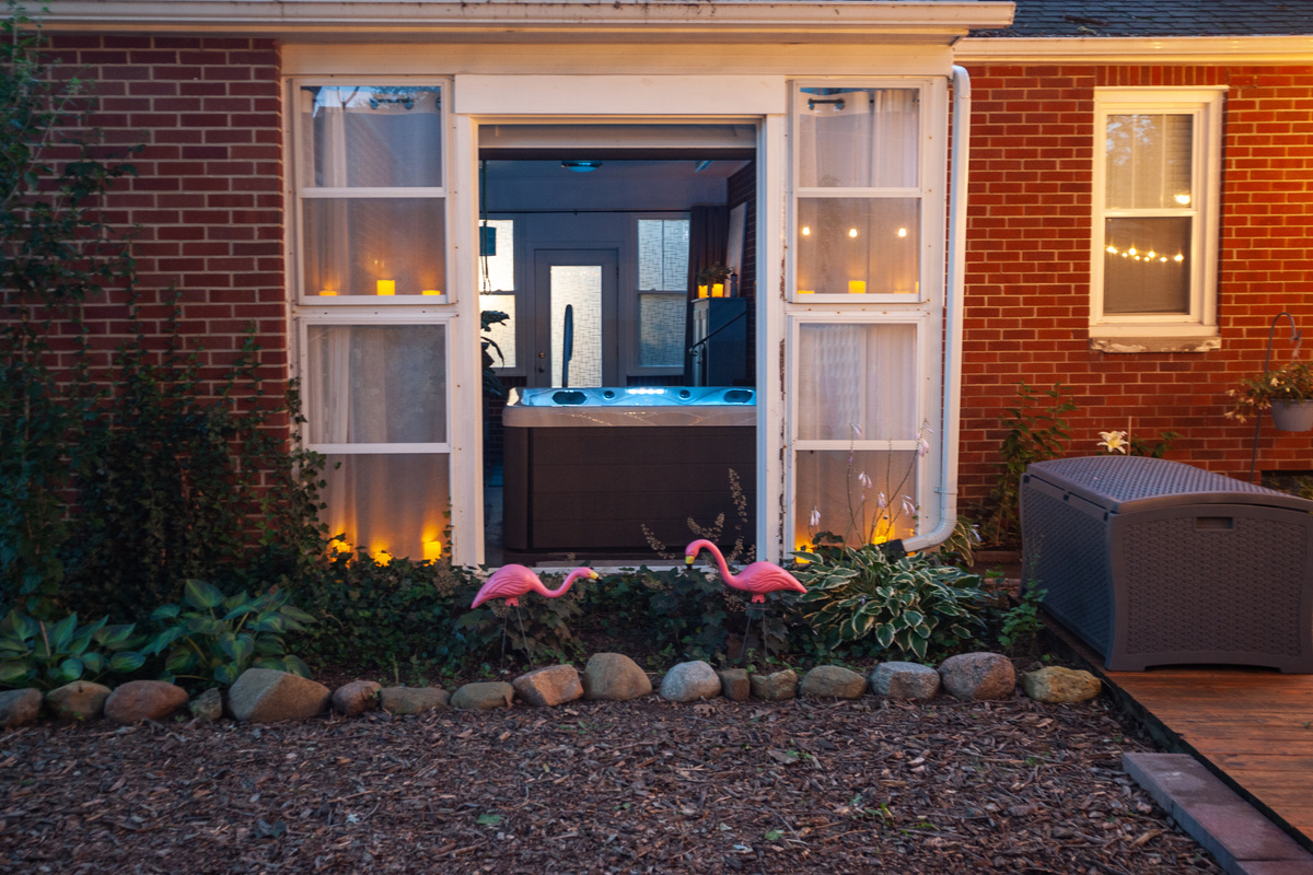 The breezeway opens up to the backyard via the custom garage door.