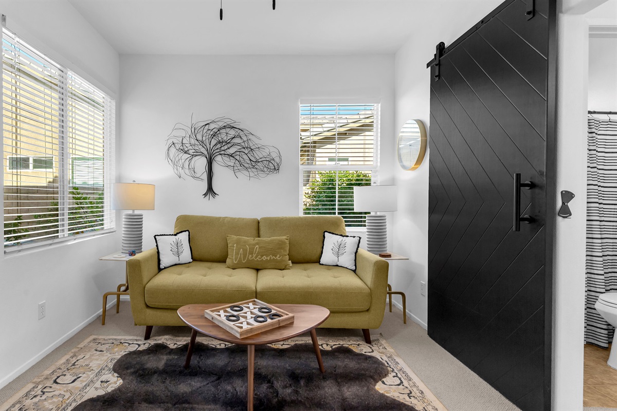 Sleek black sliding door adds a touch of modern design while creating privacy between rooms.