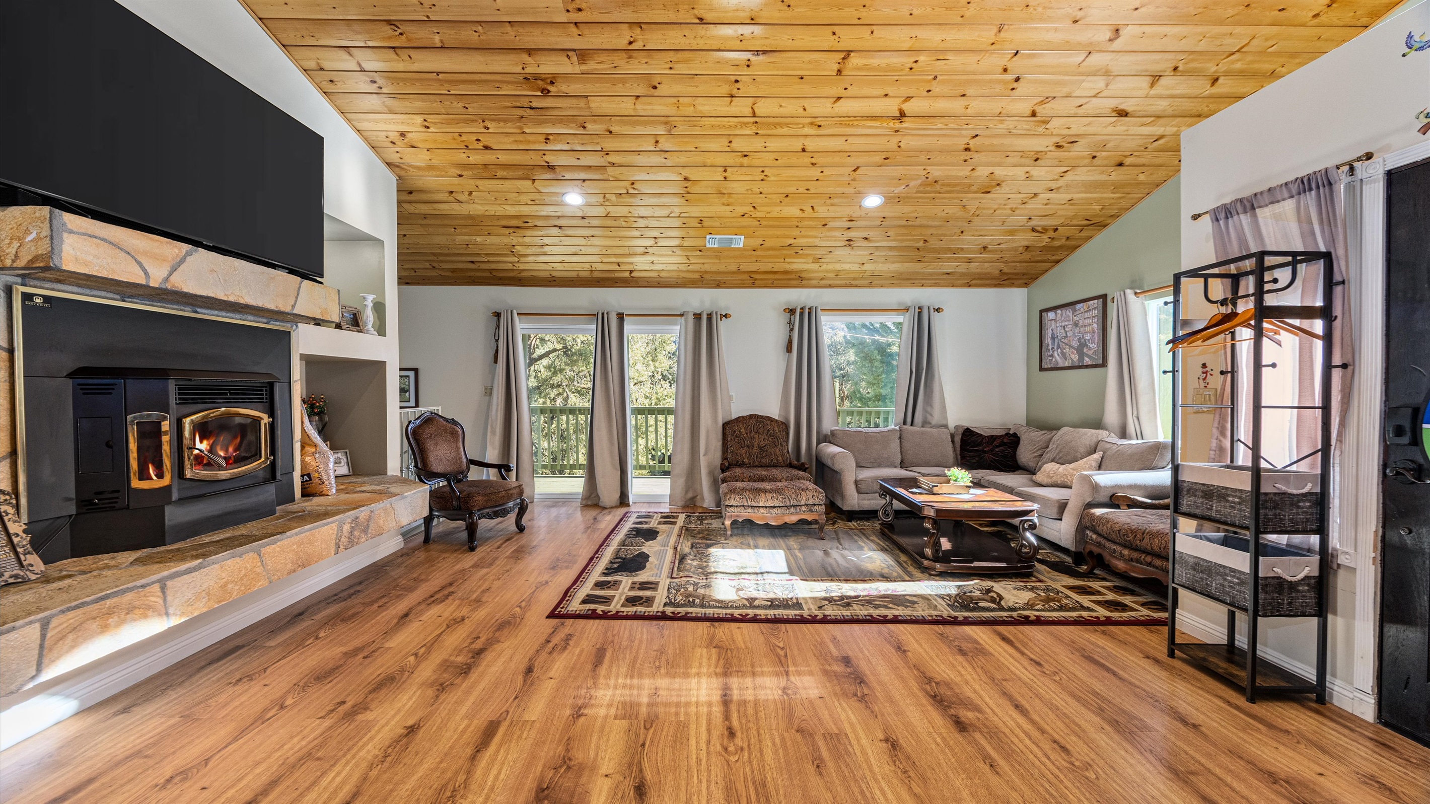 Large windows flood the living room with natural light and frame truly breathtaking views.