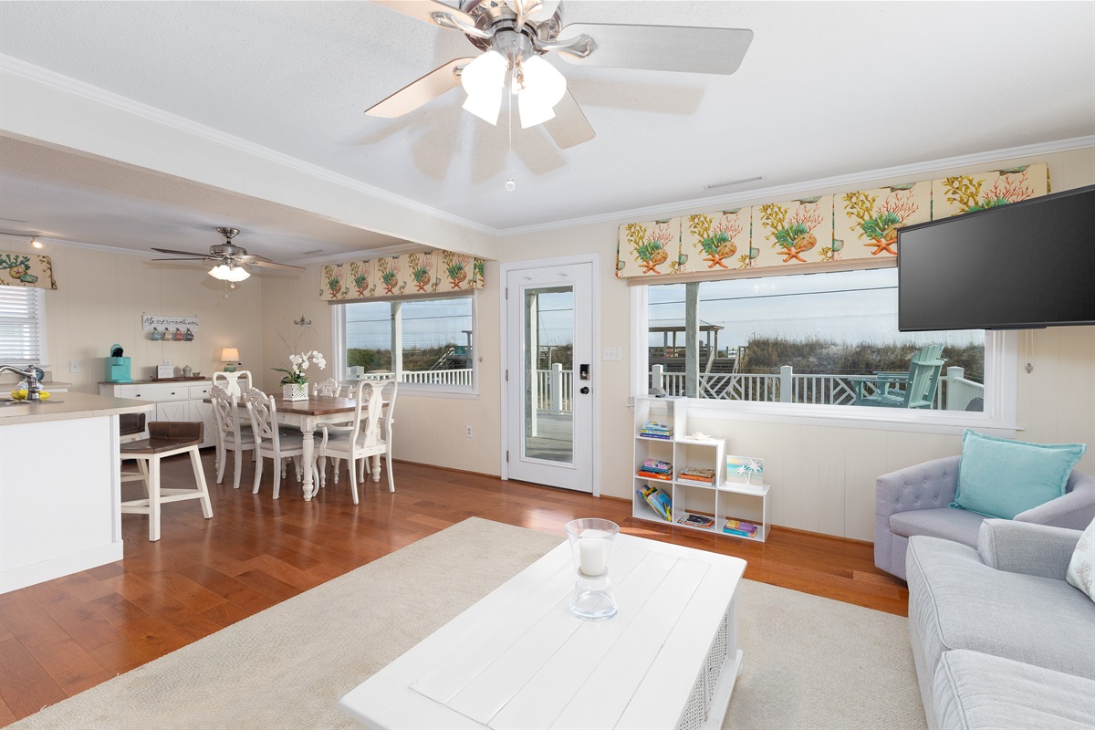 Enjoy an open living and dining space with natural light and ocean views