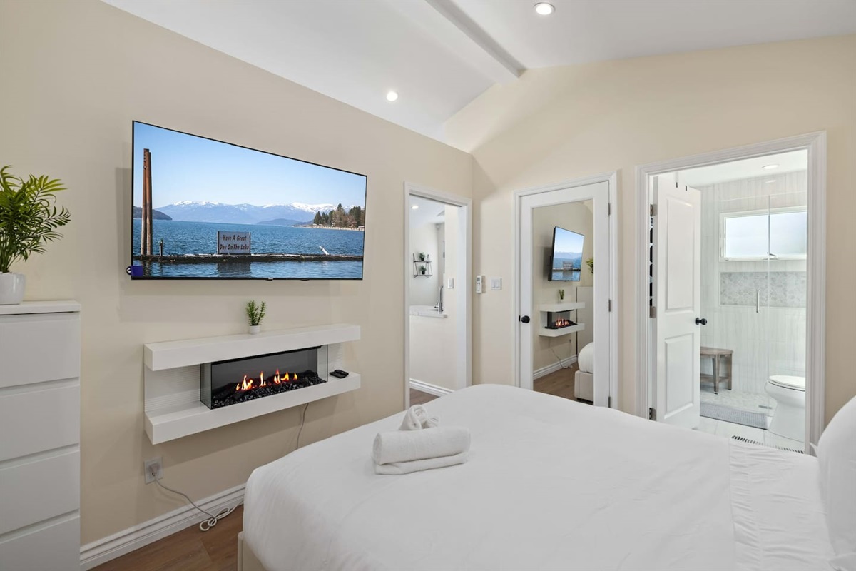 Bedroom w/ Large Flat Screen Smart TV and Fireplace