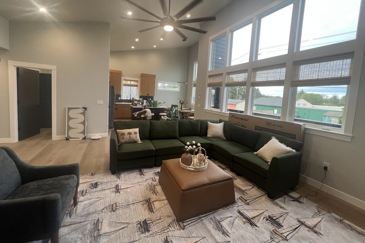 Back up on the main level, sink into the plush sectional in the light-filled great room — the spot to relax, stream and unwind together.