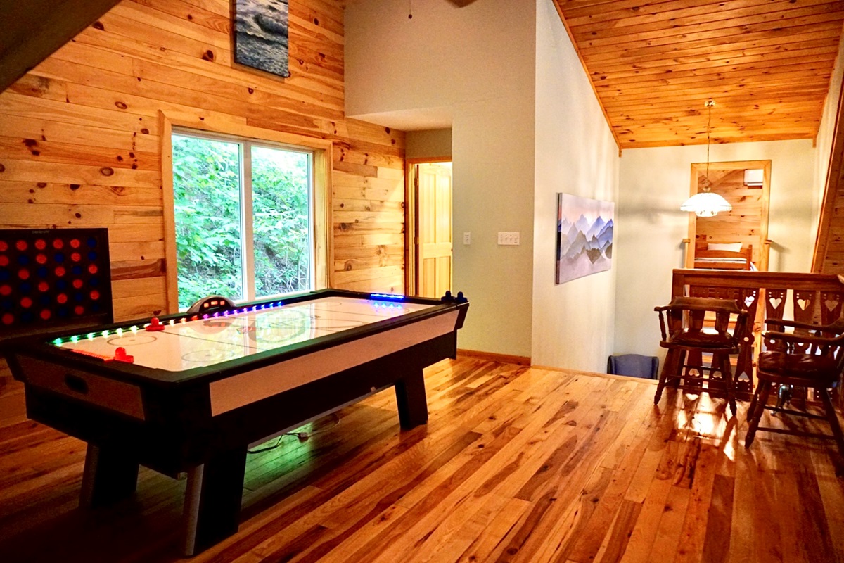 Game Room: Experience fun-filled evenings with air hockey and stunning forest views!