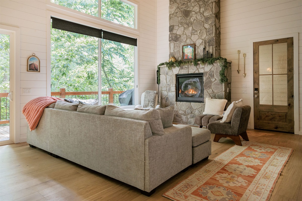 Cozy living space with view of the woods