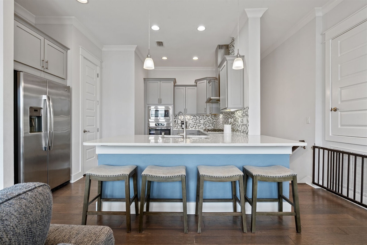 Quartz-topped island with seating for four.