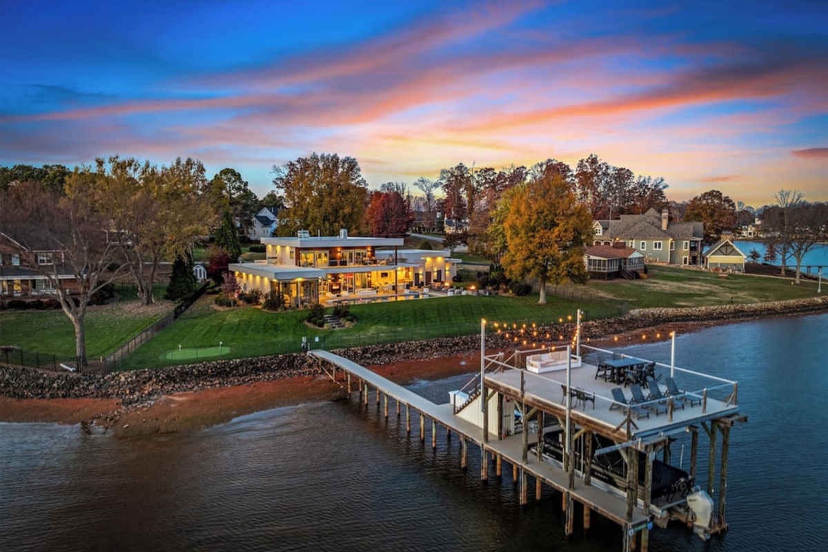 Drone shot of the house at dusk.