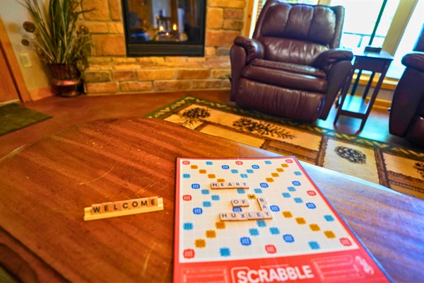 Board games included for family game night by the fireplace.