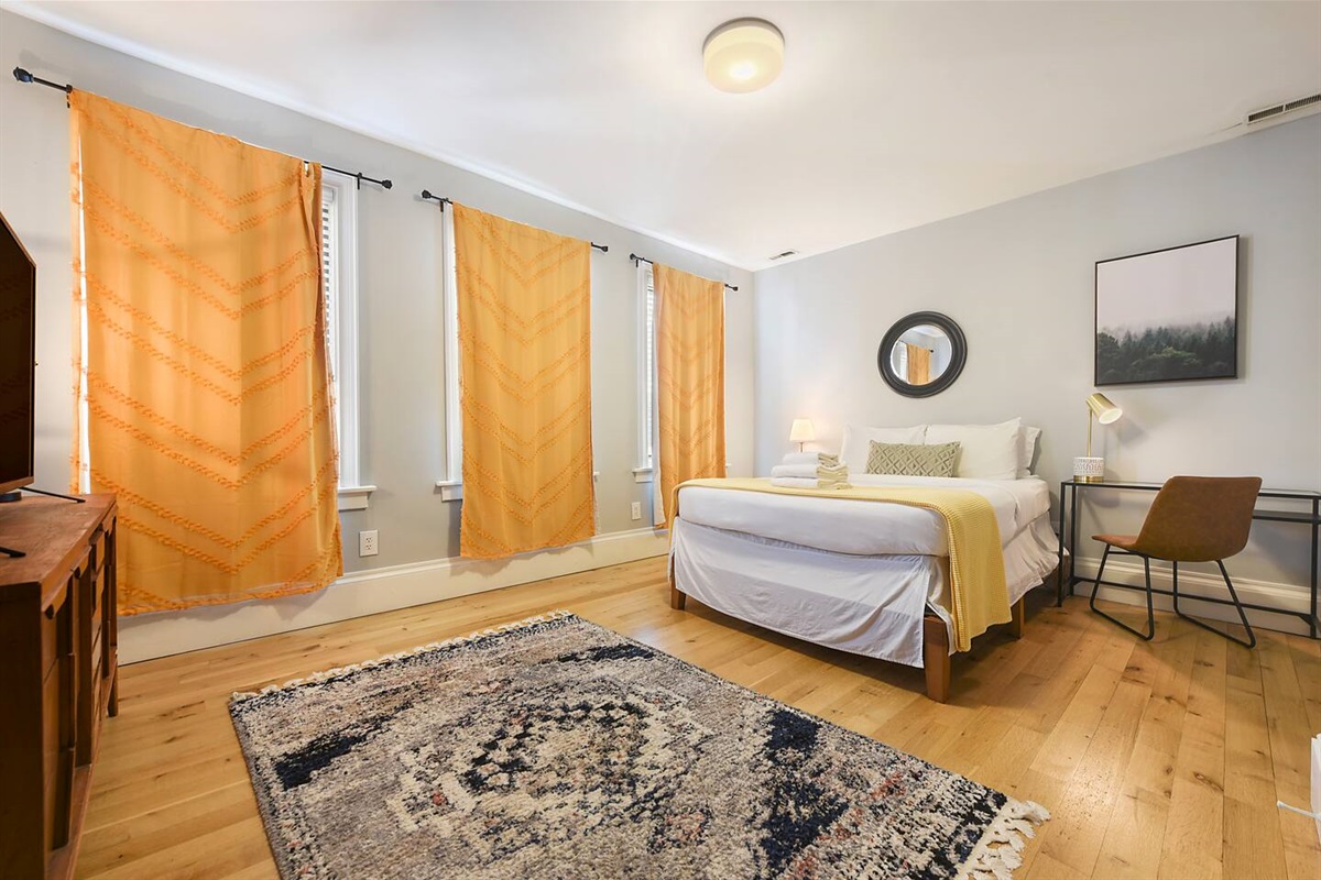 Bedroom with dedicated workspace.