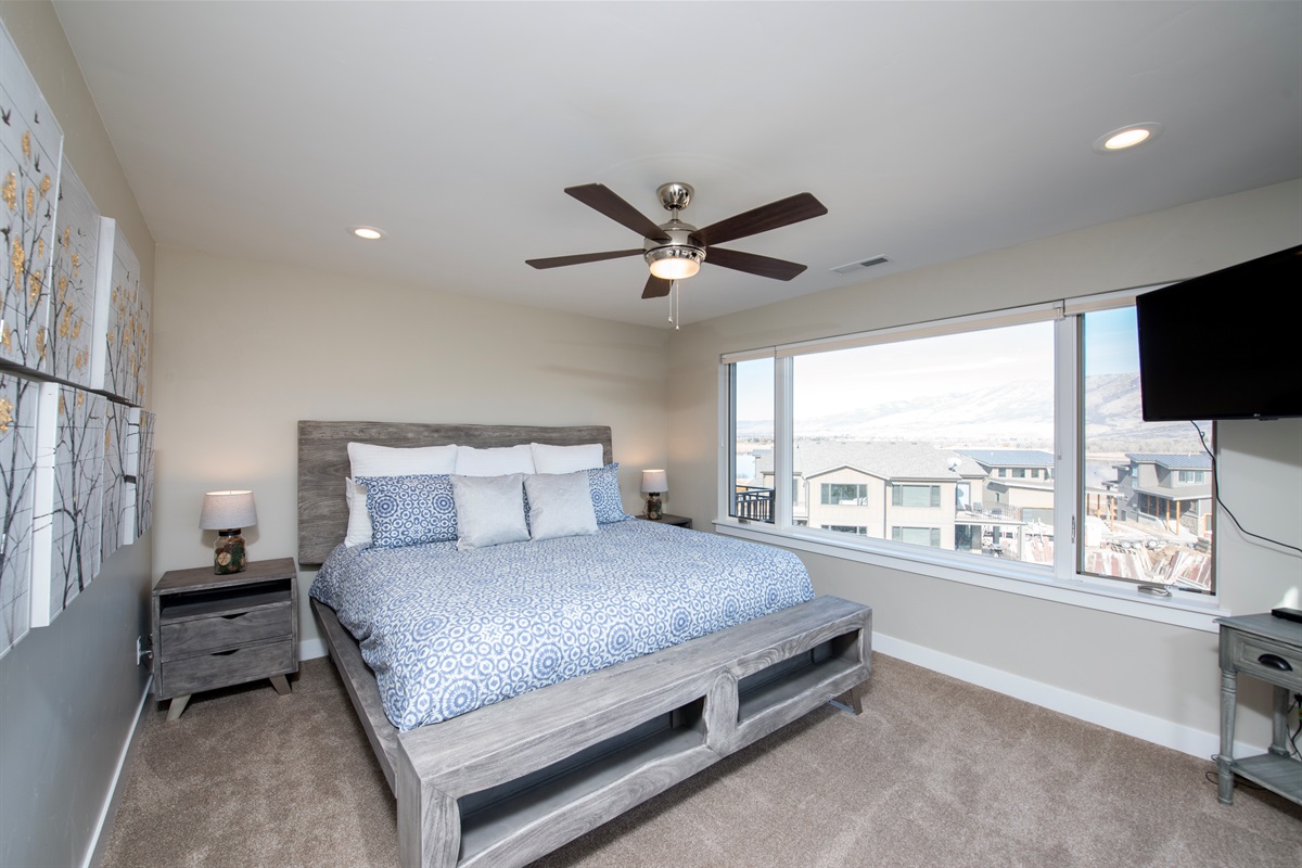 Retreat to your spacious primary suite with peaceful mountain views