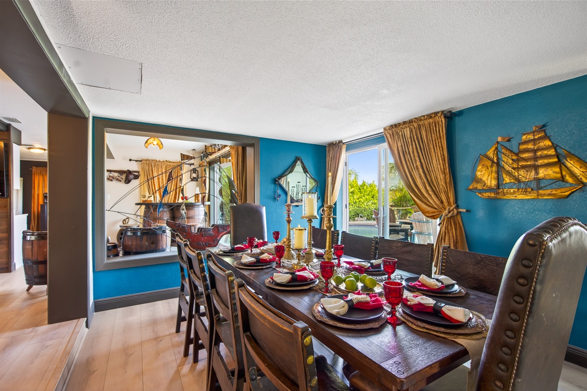 Council of Captains – The grand dining table awaits, flanked by antique chairs salvaged from a Spanish monastery. Even without a feast set, the room whispers of history, legends, and gathering