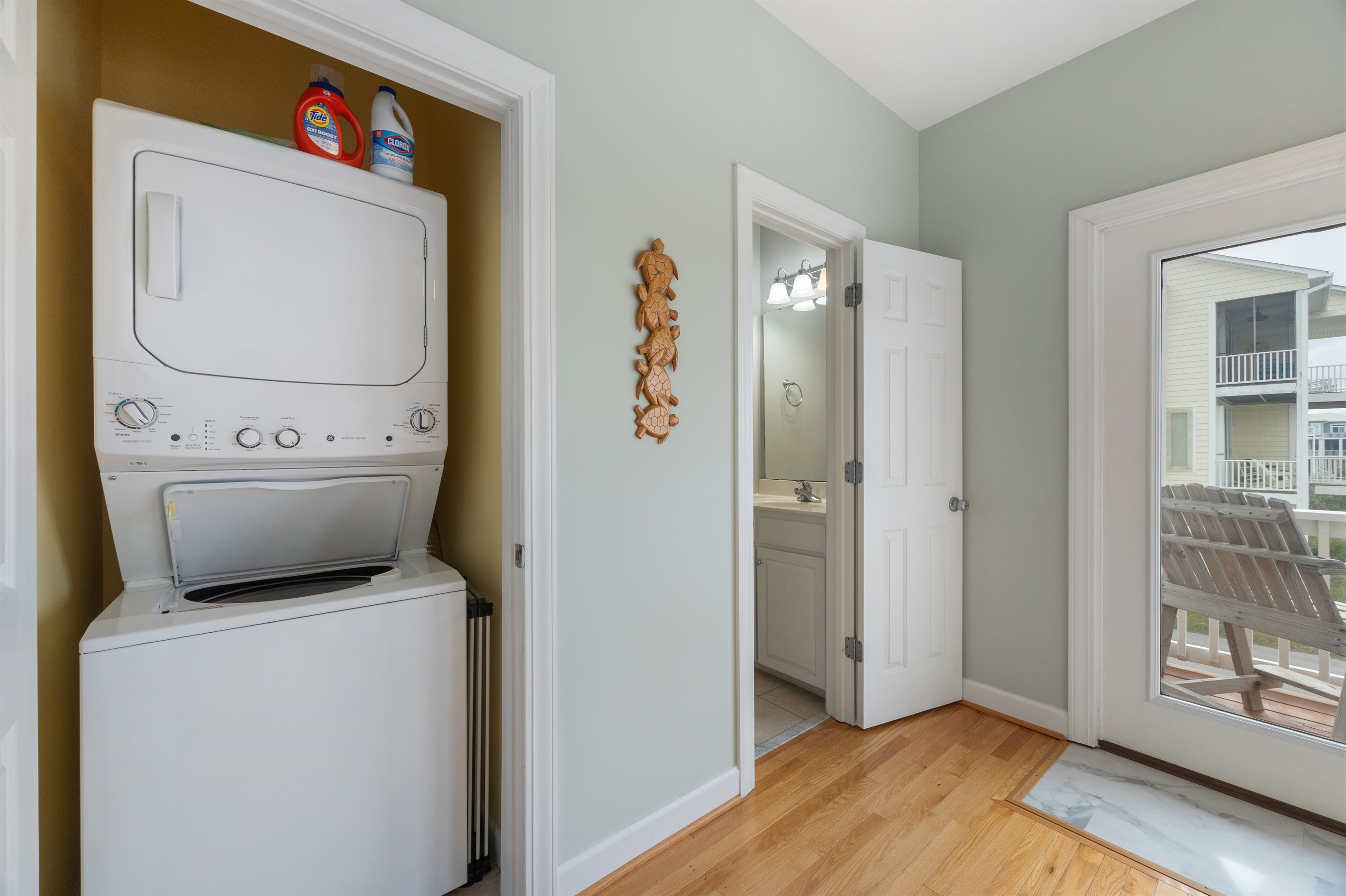 Stacked laundry units make it easy to refresh beach towels and clothes