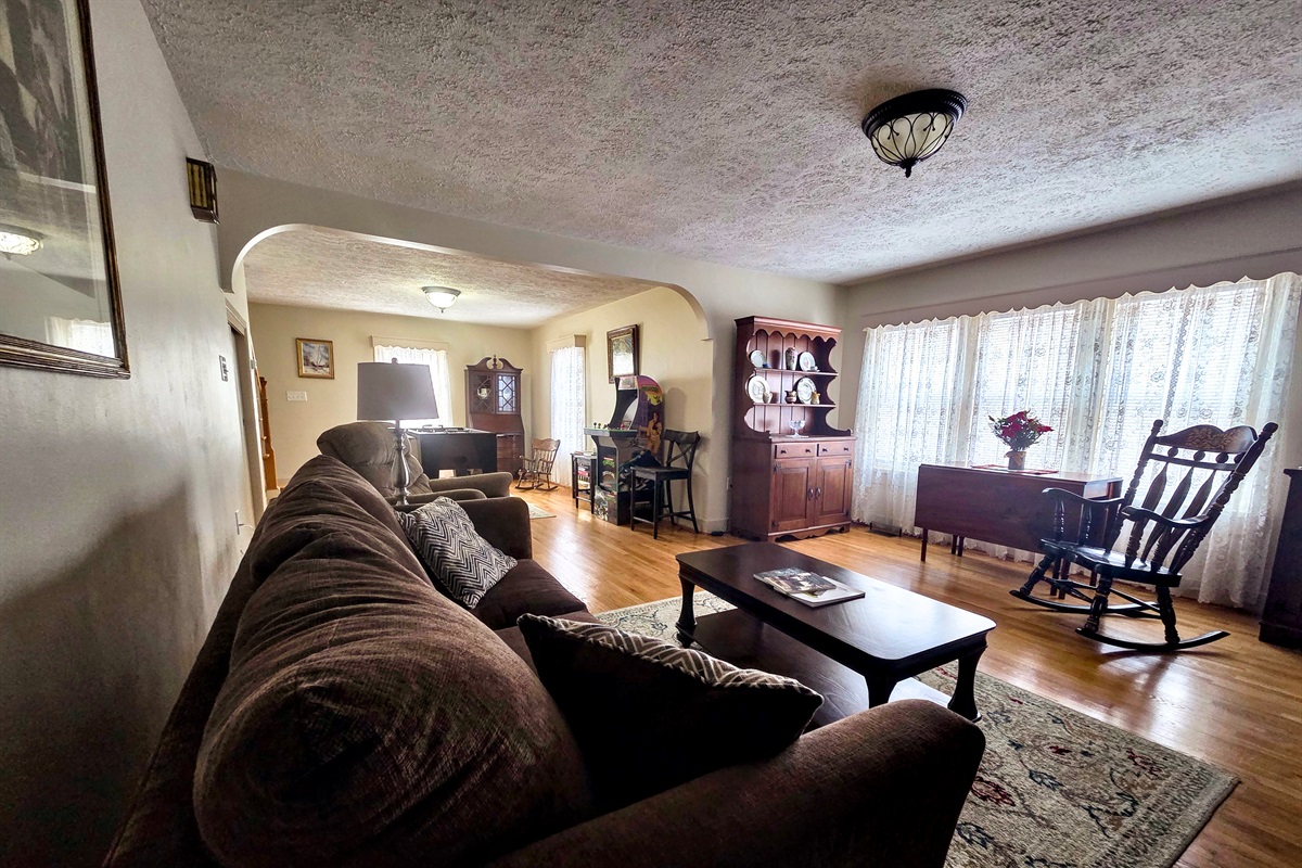 Open-concept sitting room with a dedicated game area.