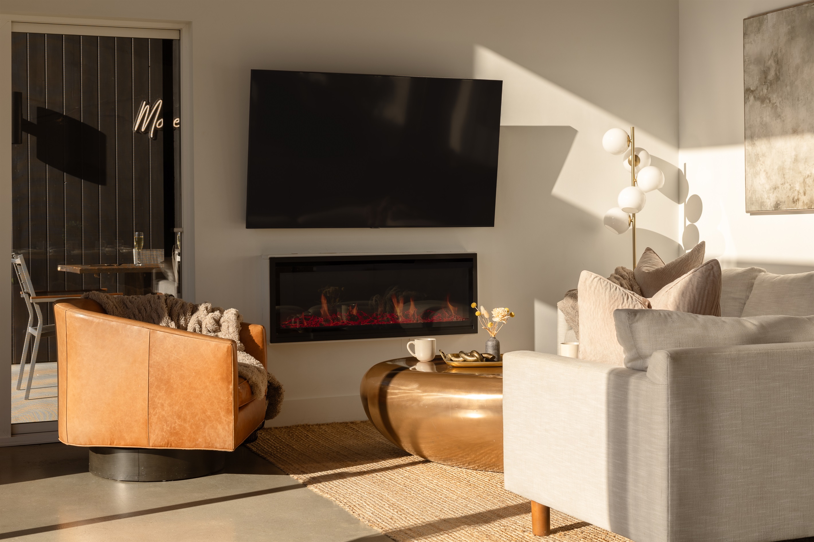 {Fireplace} Sunset light and a glowing fire—your perfect evening at Glass House.