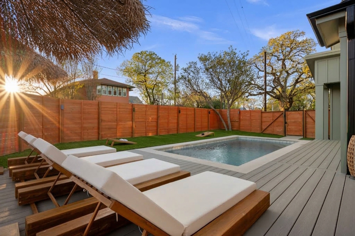 Resort-style pool area with spacious deck and outdoor seating