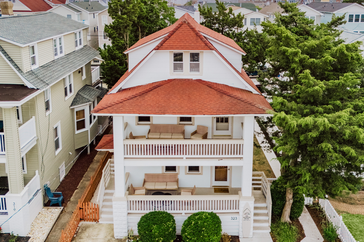 Aerial View of Front Exterior and Multi-Level Porches