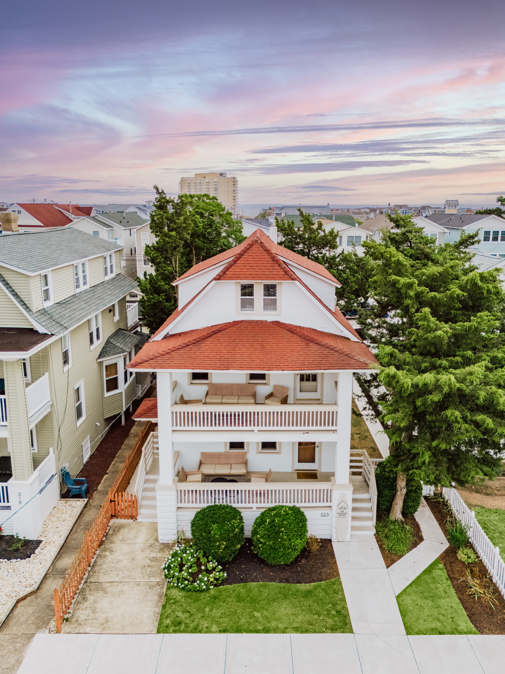 Aerial View of Front Exterior and Multi-Level Porches