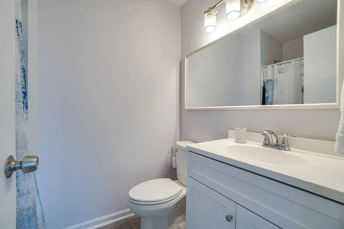 Your ensuite is right through the door &mdash; private to the queen suite, with a full tub/shower combo so you're never waiting in line.
