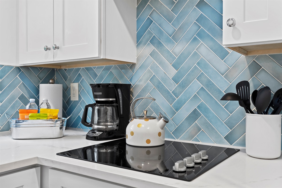 Beachy blues and sleek design create the perfect space for cooking and gathering.