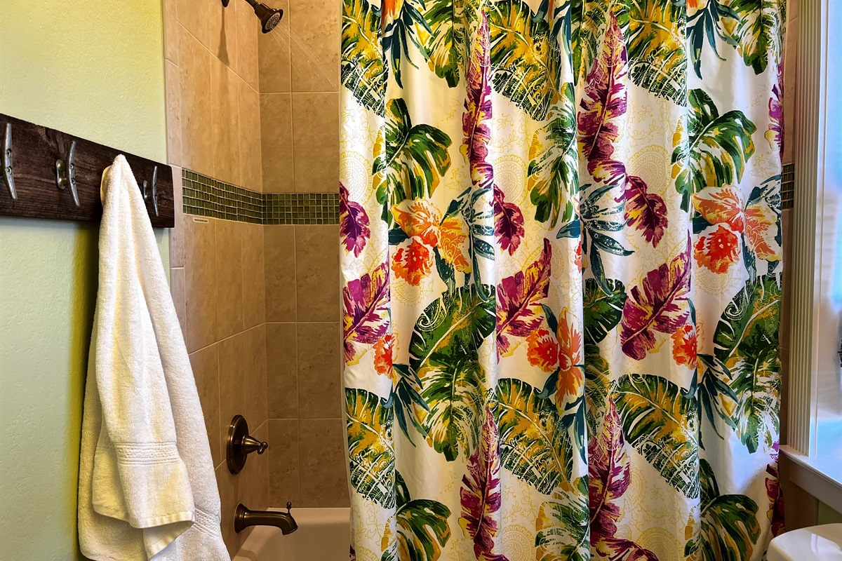 Towel hooks line the wall so you have plenty of space for...beach towels, bathing suits, and a fresh bath towel.
