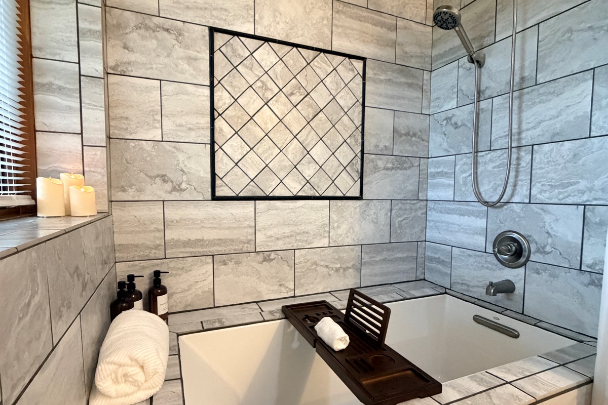 Soaking tub or rain shower, or both! And heated floors?!? 