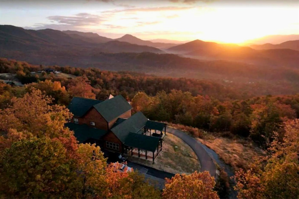 Birds Eye View of Shell Mountain Summit and the Sunset Over the Hills