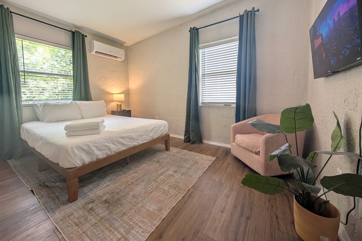 Guest room with TV and chair