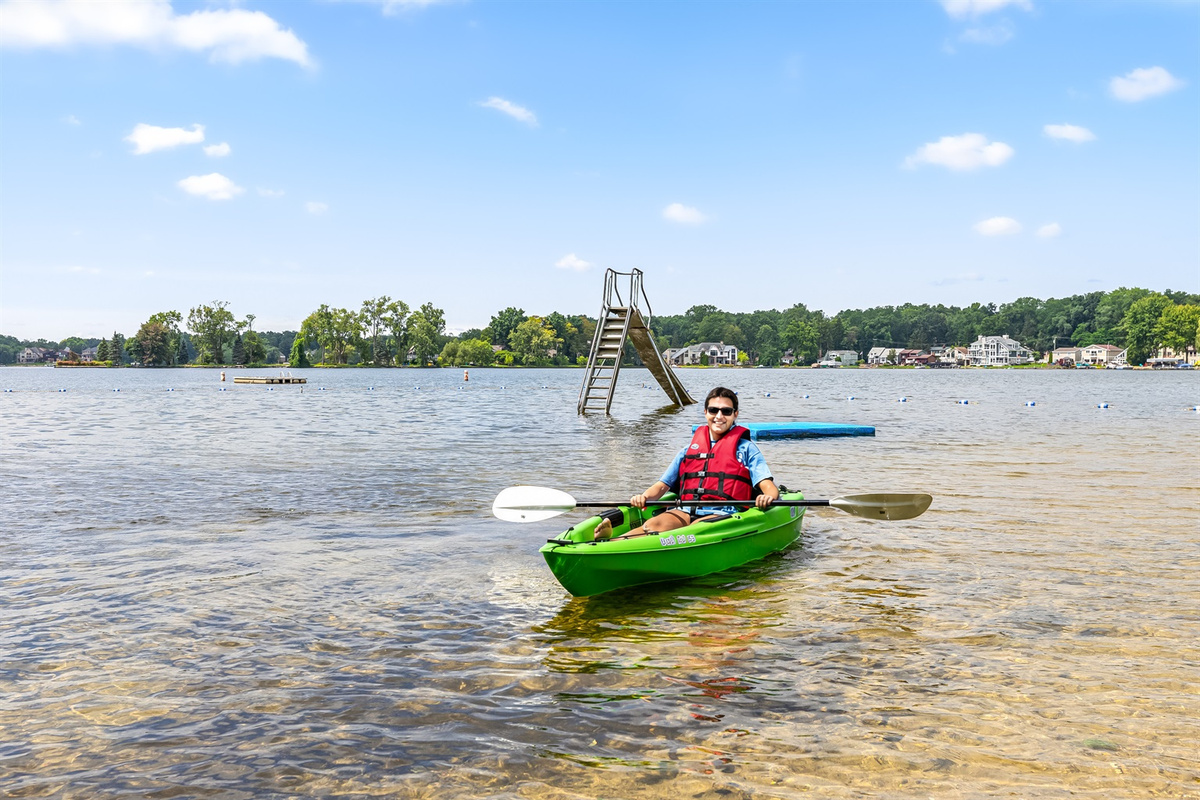 Enjoy the amenities of the private beach in the crystal clear freshwater