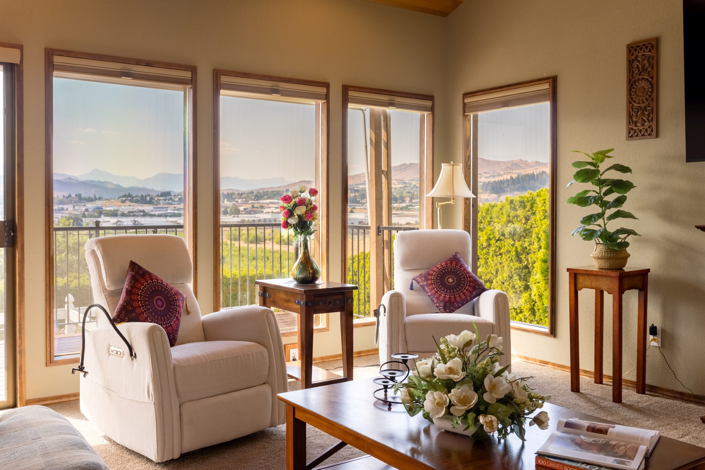 Bright and spacious great room with floor-to-ceiling windows and sweeping valley views.