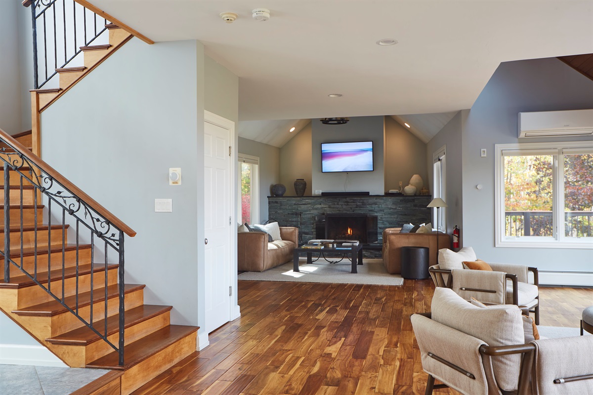 The open-concept living area and warm hardwood floors make this the perfect space to gather the whole group.